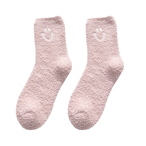 Pink coral fleece socks with embroidered smiley face for cozy winter home thermal wear