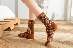 Detailed close-up of retro argyle pattern on brown mid-calf knit socks for autumn