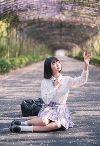 Detail of white ruffle lace socks with Japanese JK school uniform and black loafers