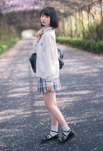 Japanese style white lace socks paired with black Mary Jane shoes and JK uniform