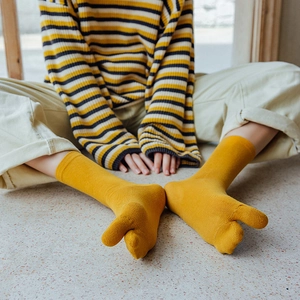 Minimalist yellow cotton two-toe tabi socks in mid-calf length for women