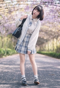 Detail of white ruffle socks paired with black Mary Jane shoes and JK school uniform