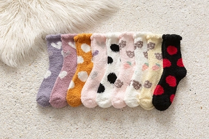 Assorted colors of thick coral fleece winter socks with heart and polka dot patterns