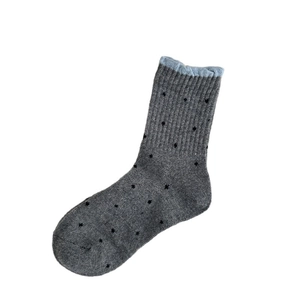 Thick wool socks in dark grey with black star patterns and light blue ribbed cuffs