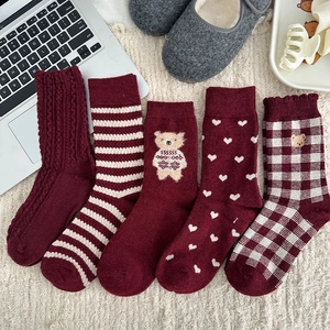 Detailed view of 5-pack dark red wool socks with bear embroidery and knit patterns
