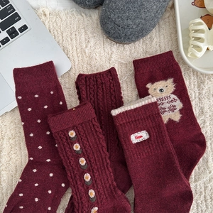 Detailed set of thick wine red wool socks with cable knit and cute bear patterns