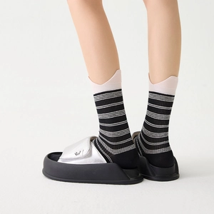 Japanese striped crew socks with pink scalloped edges paired with silver platform sandals