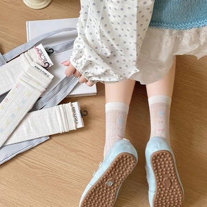 Detail of sweet breathable mesh socks with cute bow accents and floral knit patterns