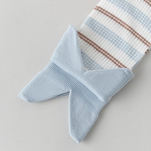 Detailed view of striped ribbed knit socks featuring a cute blue bow accent