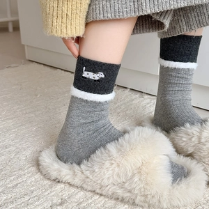 Grey rib-knit crew socks with cartoon dog embroidery and white plush trim for women