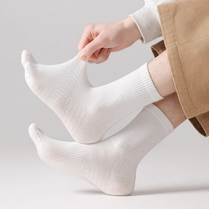 Detail of white crew athletic sock showing high elasticity and breathable mesh texture