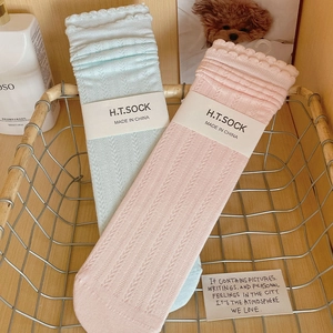 Detail of breathable hollow-out mid-calf socks with ruffle trim in pink and blue