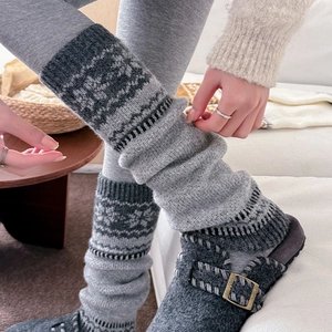Grey Fair Isle knitted leg warmers for women paired with wool felt buckle mules in cozy room
