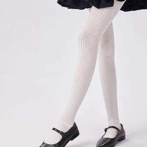 Detailed view of white ribbed over-the-knee socks showing texture and stretch