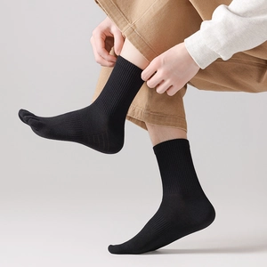 Detailed side view of black five-toe mid-calf socks with rib cuffs and breathable texture