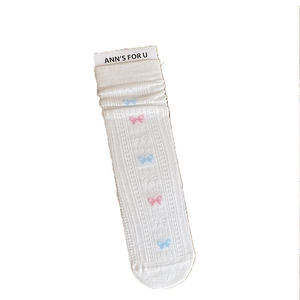 Sweet white crew socks with colorful bow patterns and frilly mesh edges for women