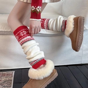 Cozy Nordic red and white knit leg warmers paired with brown faux fur lined snow boots