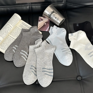 Flat lay of five colors of breathable mesh invisible socks on minimalist background