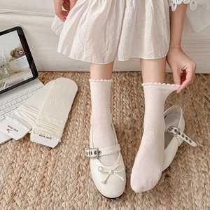 White lace trim crew socks with delicate floral texture and wavy cuffs for women