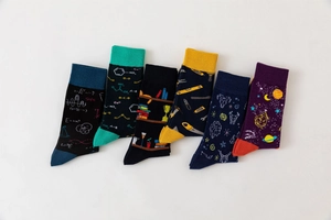 Detailed close-up of cotton socks with science patterns like physics formulas and atoms