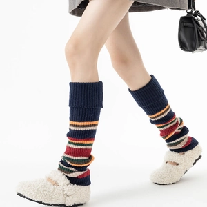 Retro striped knit leg warmers in navy and orange for a stylish autumn winter look