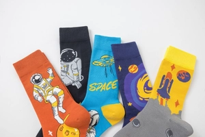 Detailed view of astronaut-themed crew socks in various vibrant colors and space patterns