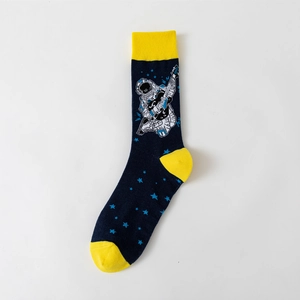 Close-up of crew sock featuring astronaut playing guitar and star pattern embroidery