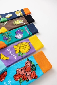 Detail showing colorful tropical fruit pattern cotton socks in five vibrant styles