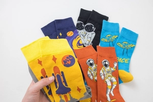 Detailed collection of men's cotton crew socks with colorful astronaut and space patterns