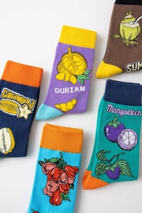 Detail view of cotton crew socks featuring colorful tropical fruit patterns like durian and coconut
