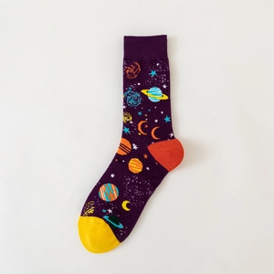 Detail of space-themed purple crew socks with planet prints and colorful contrast heel
