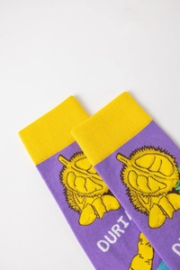 Detailed macro view of tropical durian pattern on purple and yellow crew socks