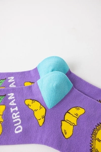 Detailed close-up of durian pattern knit texture on purple cotton crew socks for men