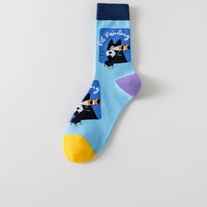 Close-up of cat motif jacquard pattern on blue cotton sock with textured 3D eye detail