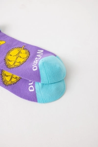 Close-up of purple cotton sock with yellow durian pattern and light blue toe detail