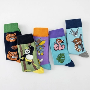 Detail view of five pairs of men's cotton socks with creative animal face illustrations