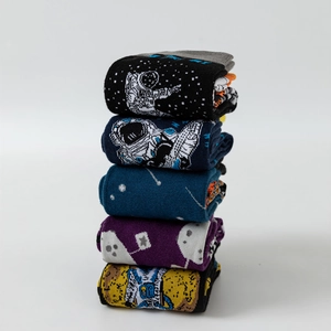 Five pairs of astronaut themed cotton crew socks with colorful space patterns and thick soles