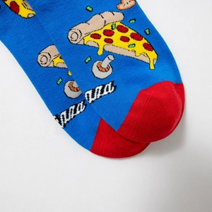 Close-up of knit pizza pattern and red toe detail on bright blue cotton crew socks