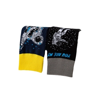 Astronaut themed mid-calf cotton socks with navy blue and black knit cosmic patterns