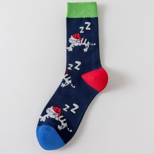 Detail of winter cotton socks showing knit texture with a sleeping cat festive pattern