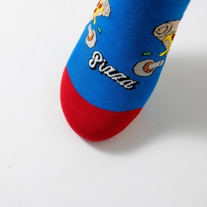 Macro shot of blue cotton sock featuring pizza patterns and red toe color block detail