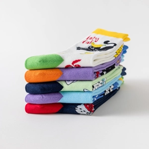 Detailed close-up of colorful cotton socks featuring lazy cat patterns and jacquard knit textures