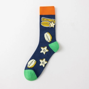 Detail of navy blue cotton socks with tropical carambola pattern and orange cuffs