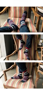 Detail of men's crew socks with stylish navy blue and red stripes in soft cotton knit