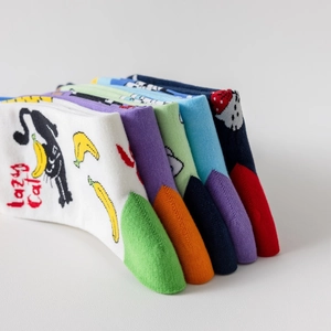 Close-up of colorful cotton socks with jacquard cat patterns and lazy cat text detail