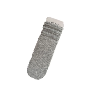 Grey knit slouch socks with ripple texture and elastic cuffs on a white background