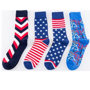 Flat lay of four colorful mid-calf cotton socks with stars, stripes and geometric patterns