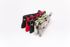 Detailed view of five pairs of men's cotton socks with geometric patterns and patterns