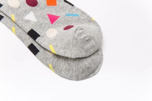 Detailed close-up of colorful geometric patterns on gray knitted cotton socks for men