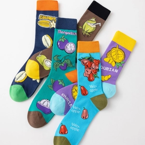Tropical fruit themed crew socks featuring colorful carambola and mangosteen patterns